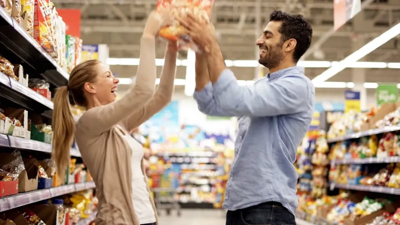 Veo 3.1 Lite video: a man and a woman reaching for the same cereal box in a supermarket aisle and laughing